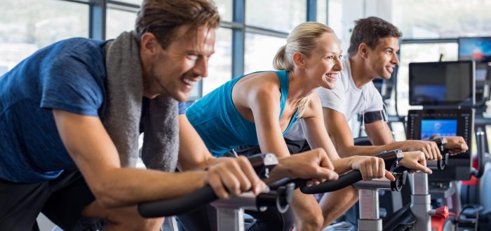 People on exercise bike