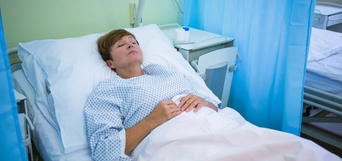 Senior patient lying on a bed
