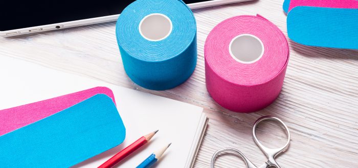 kinesiology, physiotherapy and therapeutic tape on doctor desk