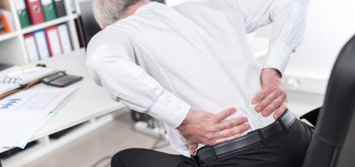 Businessman suffering from back pain