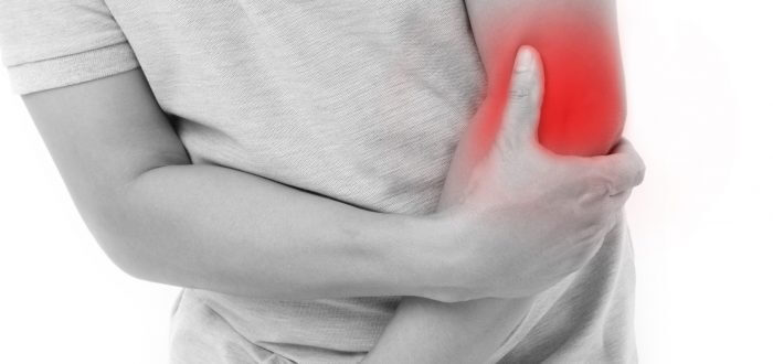 man suffering from elbow joint pain