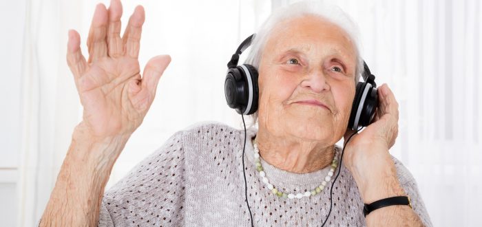 Senior Woman Enjoying Music With Headphone